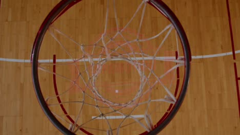 HIGH-ANGLE-JIB-SHOT-View-of-basketball-basket-at-the-indoor-sports-arena.-4K-UHD-50-FPS-SLO-MO